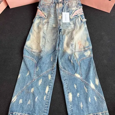 Jeans in the catalogue: Acne Studios Distressed Wide-Leg Jeans